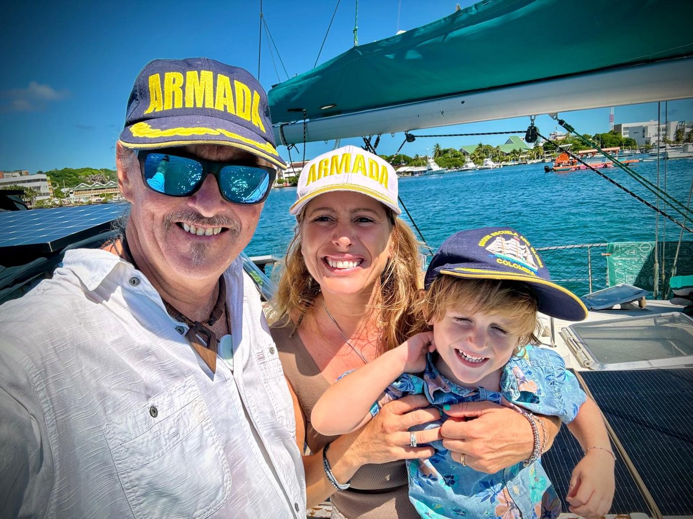 Rick, Maddy and Ricci in matching caps aboard