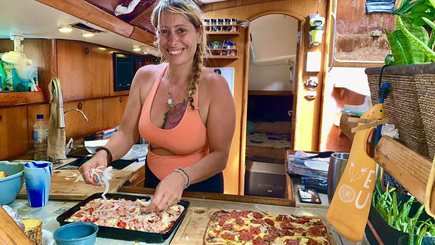 Maddy making homemade pizzas in the galley