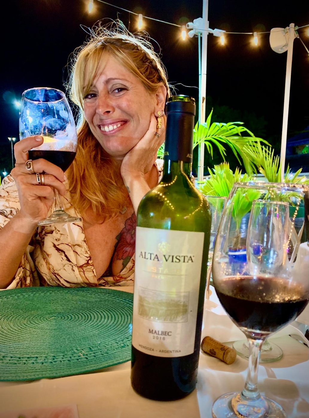 Maddy enjoying a glass of Malbec at a dinner out